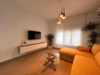 Una televisión o centro de entretenimiento en Apartamento Entre dos Puentes