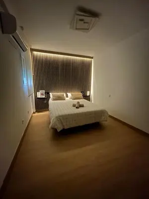 Cama o camas de una habitación en Apartamento Entre dos Puentes