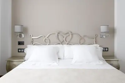 Cama o camas de una habitación en Hotel Infanta Leonor