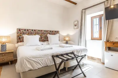 Cama o camas de una habitación en Hospedium Hotel Rural Virgen María