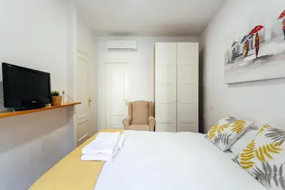 Cama o camas de una habitación en Alohamundi Joaquín Costa