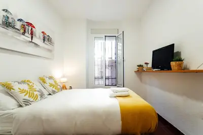 Cama o camas de una habitación en Alohamundi Joaquín Costa
