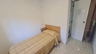 Cama o camas de una habitación en ALBERGUE LA TIÑOSA