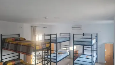 Cama o camas de una habitación en ALBERGUE LA TIÑOSA