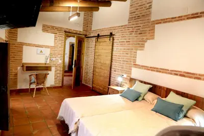Cama o camas de una habitación en casa rural Cieza de León