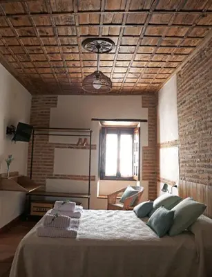 Cama o camas de una habitación en casa rural Cieza de León