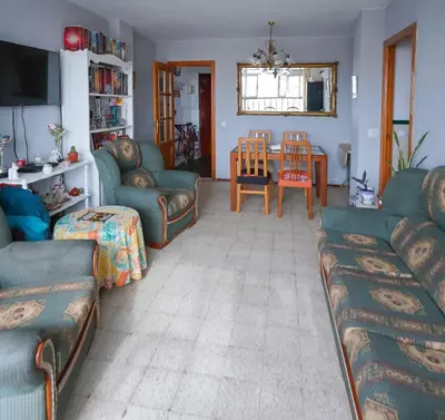 Zona de estar de Habitaciones privadas con cama doble en Sevilla