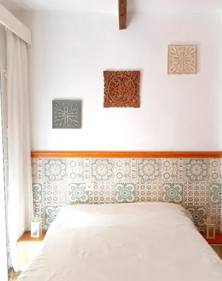 Cama o camas de una habitación en La Casa de las Flores Sevilla