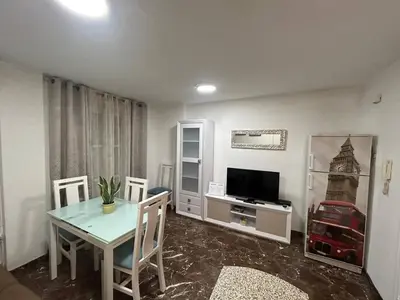 Una televisión o centro de entretenimiento en Apartamento García Requena
