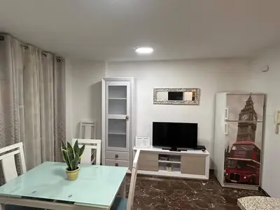 Una televisión o centro de entretenimiento en Apartamento García Requena