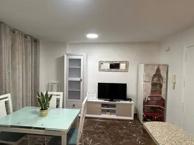 Una televisión o centro de entretenimiento en Apartamento García Requena