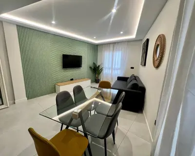 Una televisión o centro de entretenimiento en Apartamento El Cardenal