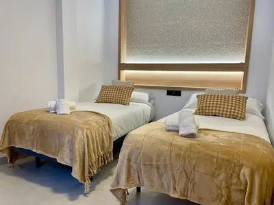 Cama o camas de una habitación en Geysotur Suite El Geranio