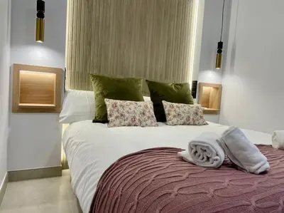 Cama o camas de una habitación en Geysotur Suite El Geranio