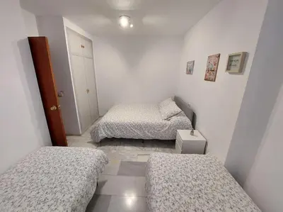 Cama o camas de una habitación en El Patio de Lola