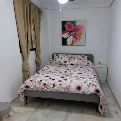 Cama o camas de una habitación en El Patio de Lola
