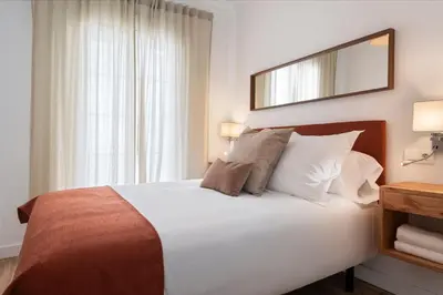 Cama o camas de una habitación en Magno Apartments Ave María