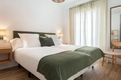 Cama o camas de una habitación en Magno Apartments Ave María