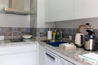 Una cocina o zona de cocina en Apartamentos San Francisco