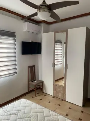 Una televisión o centro de entretenimiento en APARTAMENTOS LEONOR
