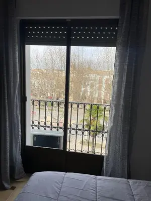 Cama o camas de una habitación en APARTAMENTOS LEONOR