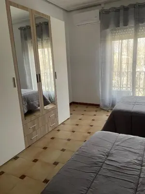 Cama o camas de una habitación en APARTAMENTOS LEONOR