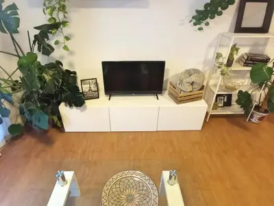 Una televisión o centro de entretenimiento en Apartamento Luz de Levante