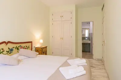 Cama o camas de una habitación en Lovely apartment in Sevilla
