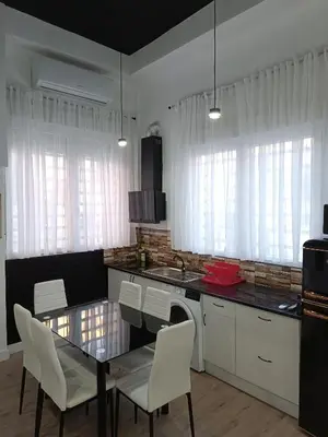 Una cocina o zona de cocina en Apartamentos Mezquita Catedral, Saqunda