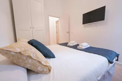 Cama o camas de una habitación en Apartamento a estrenar junto al centro de la ciudad