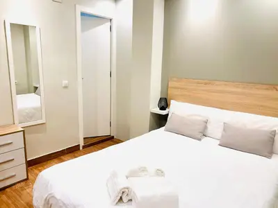 Cama o camas de una habitación en Plaza de Andalucía Home con parking