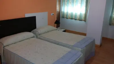 Cama o camas de una habitación en Hotel Mesón El Número Uno