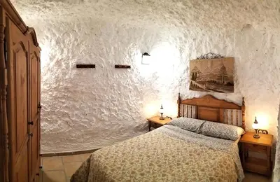 Cama o camas de una habitación en CASA CUEVA EL OLIVO