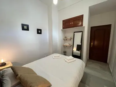 Cama o camas de una habitación en RgHOST-Apartamento La Palma en Casco Histórico