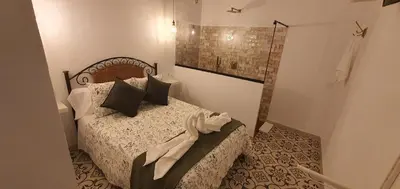 Cama o camas de una habitación en La Morería y su jacuzzi
