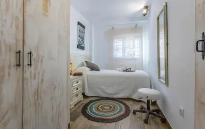 Cama o camas de una habitación en Good times Sevilla