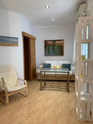 Zona de estar de Bonito, tranquilo y fresco apartamento en Nervión.
