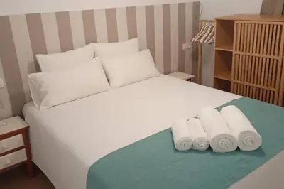 Cama o camas de una habitación en Bonito, céntrico y fresco apartamento Santa Marina