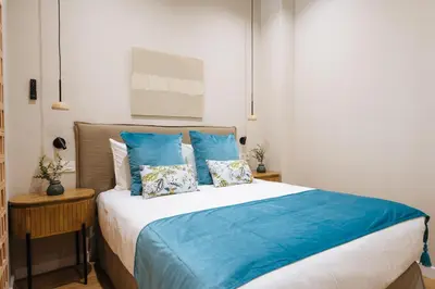 Cama o camas de una habitación en New Hostly Alameda Apartments