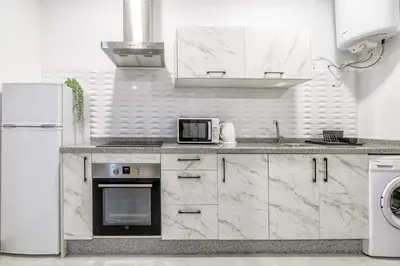 Una cocina o zona de cocina en Apartamentos Suite Sol