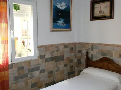 Cama o camas de una habitación en Alojamiento Los Poetas