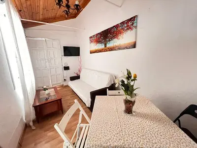 Una televisión o centro de entretenimiento en Somos Sevilla Private Apartments