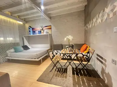 Cama o camas de una habitación en Somos Sevilla Private Apartments