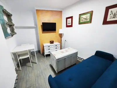 Una televisión o centro de entretenimiento en Apartamento PUERTA DE CÓRDOBA