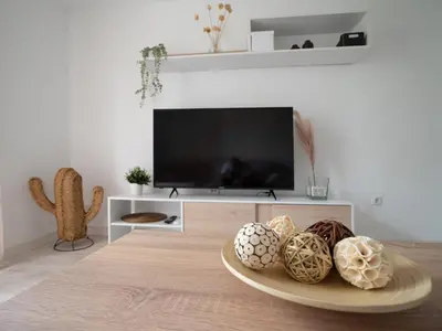 Una televisión o centro de entretenimiento en Luxury Home Mezquita