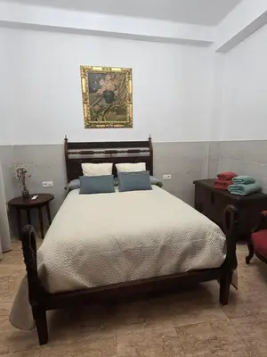 Cama o camas de una habitación en Casa de la Tata la Judería Sevilla