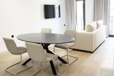 Una televisión o centro de entretenimiento en Apartamentos MLC Ciudad de Linares
