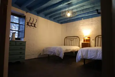 Cama o camas de una habitación en Casa Rural El Ayozar