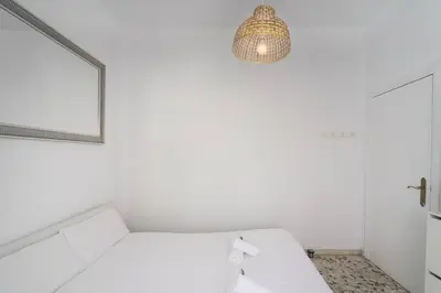 Cama o camas de una habitación en Ático ISPAL con Terraza en Centro