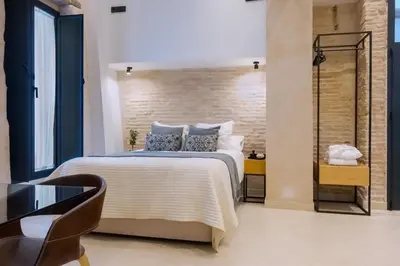 Cama o camas de una habitación en Luxurious studio with Jacuzzi in Casa Pilatos